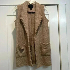 Tahari tan colored vest size small. In really good condition!